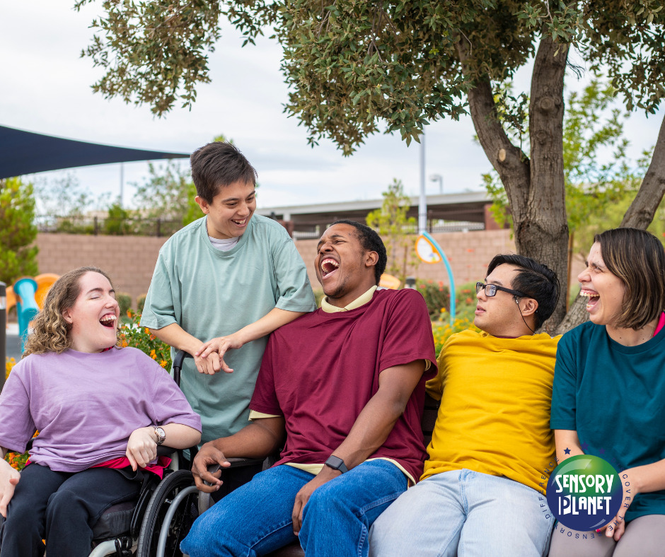Photograph of five individuals with disabilities laughing